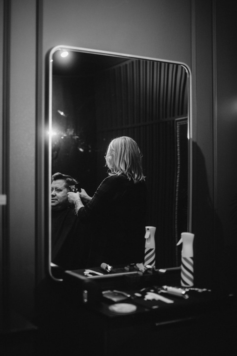 a person standing in front of a mirror brushing their teeth